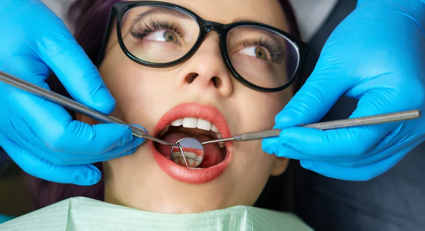 A professional dental cleaning in progress